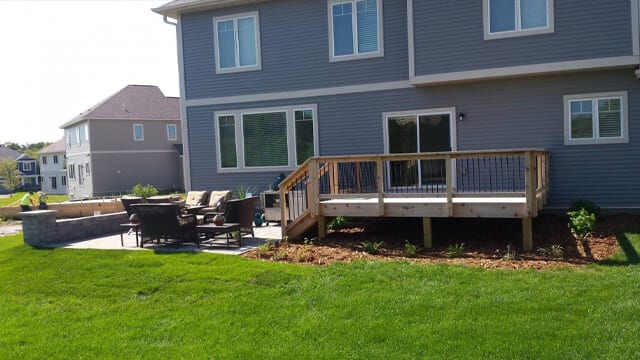 Landscaping done on a new build which indcludes new plantings, mulch beds, and a patio