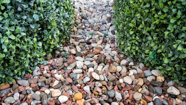 Landscaping Ideas for Your Backyard - Decorative sprinkling of flowerbed paths with gravel