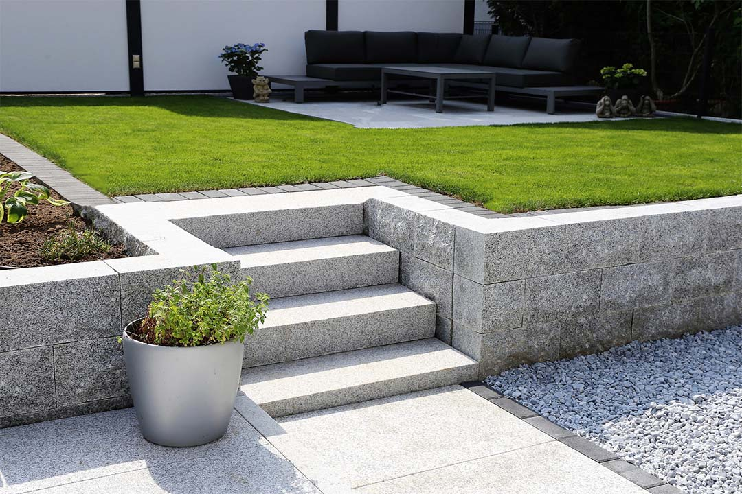 Low-maintenance retaining walls and hardscaping will continue to trend in 2023.